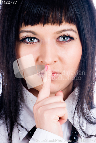 Image of Woman gesturing to silence