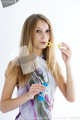Image of Attractive girl with soap bubbles