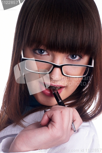 Image of Girl biting pen