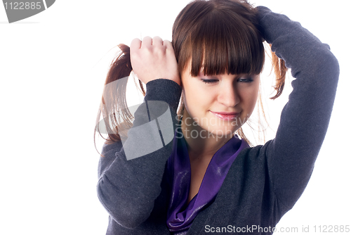 Image of Woman with hands in hair