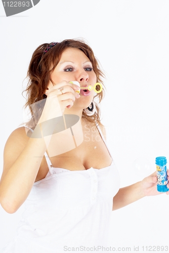 Image of Attractive girl with soap bubbles