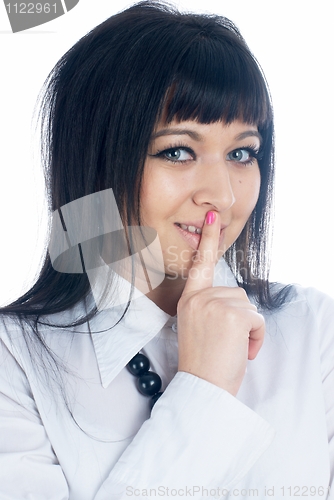 Image of Woman gesturing to silence