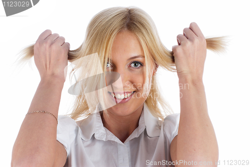 Image of Woman with hands in hair