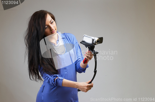 Image of Young woman with camera