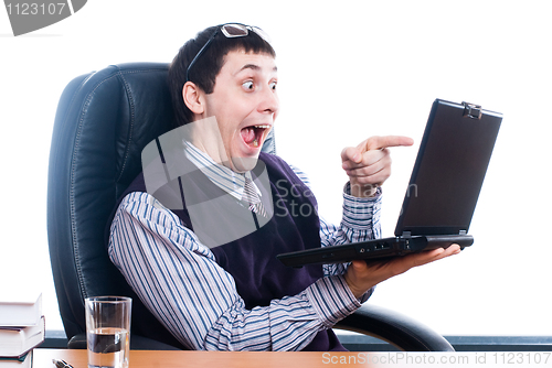 Image of Young businessman with laptop