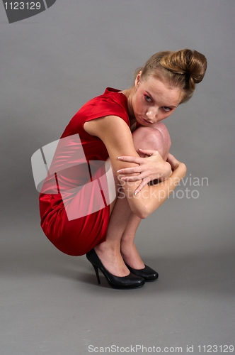Image of Sexy slim woman in red dress