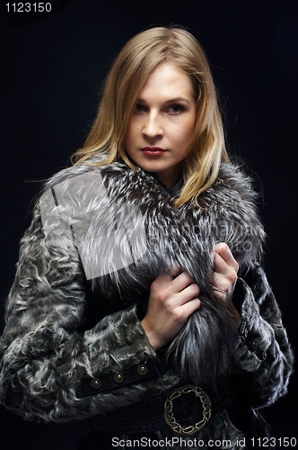 Image of Attractive woman in fur coat