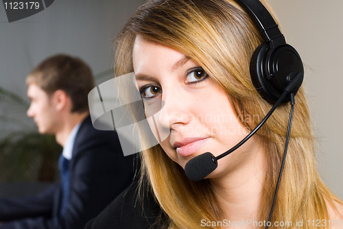 Image of Beautiful business woman with headset