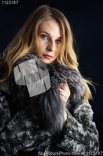 Image of Attractive woman in fur coat