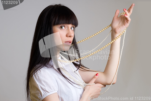 Image of Girl with beads