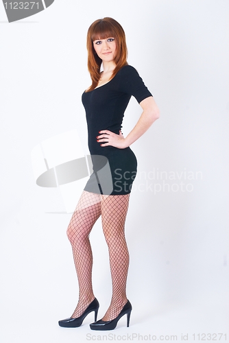 Image of Beautiful red-haired girl with beads