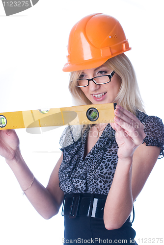 Image of Woman in helmet with level