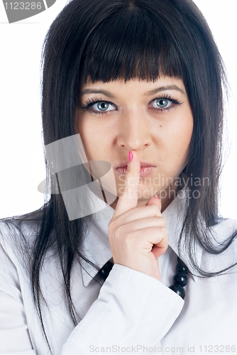 Image of Woman gesturing to silence