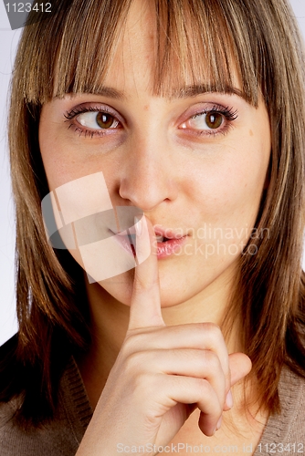 Image of Woman gesturing to silence