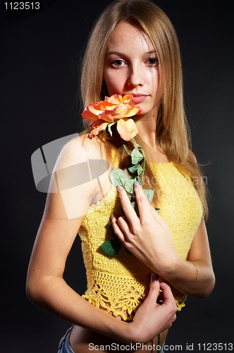 Image of Pretty girl with flower