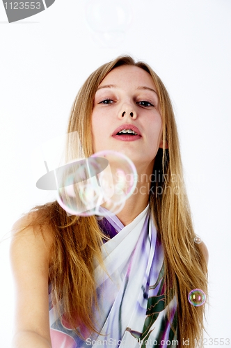 Image of Attractive girl with soap bubbles