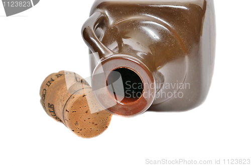 Image of Ceramic bottle and a cork on a white background