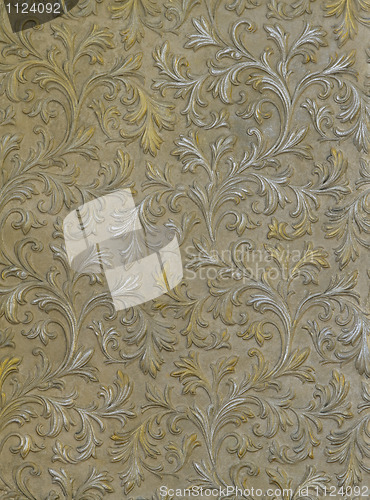 Image of wall texture with with the silver and gold leaves 