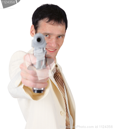 Image of Young man in white suit with pistol