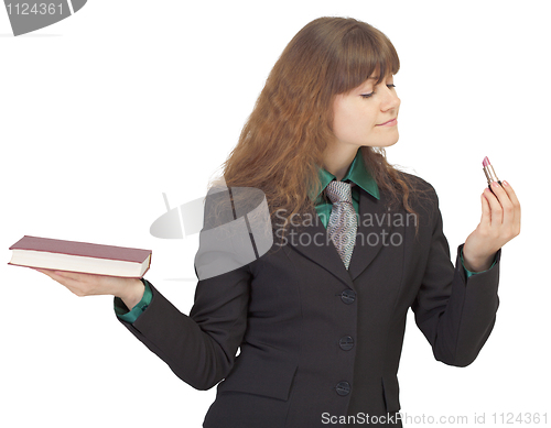 Image of Young student interested in cosmetics more than study