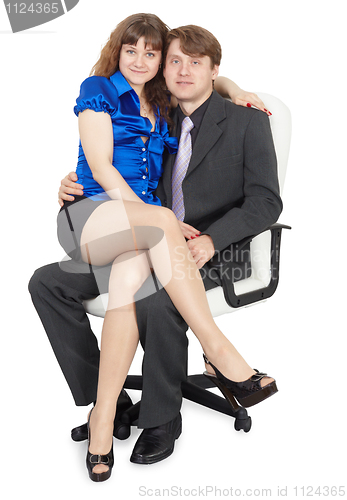 Image of Young couple sitting on office chair