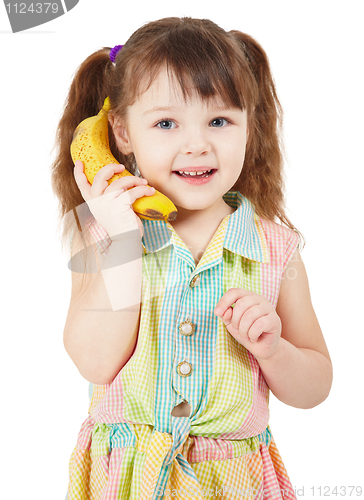 Image of Child uses a banana as a mobile phone