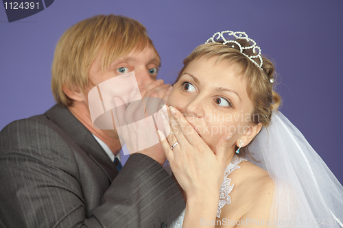 Image of Groom tells to bride confidential news