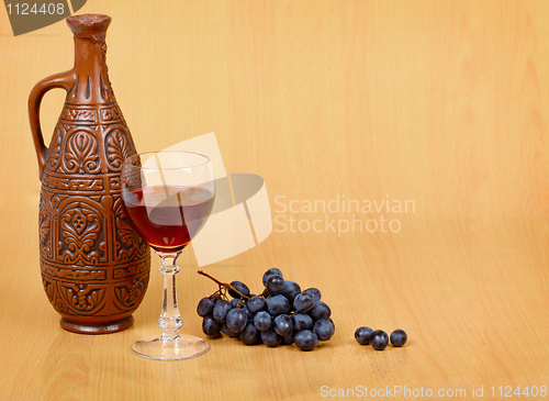 Image of Artistic composition - crock, glass and grapes