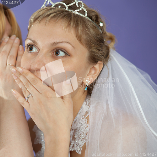 Image of Bride emotionally listens to latest news