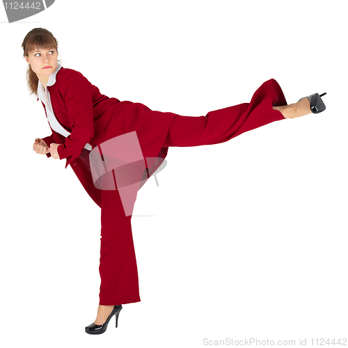 Image of Young woman kicks back on white background
