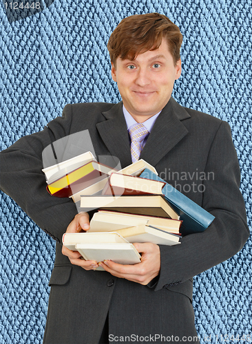 Image of Funny guy with an armful of textbooks