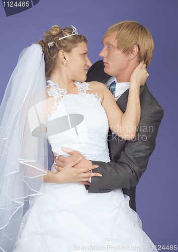 Image of Romantic groom and bride on lilac background