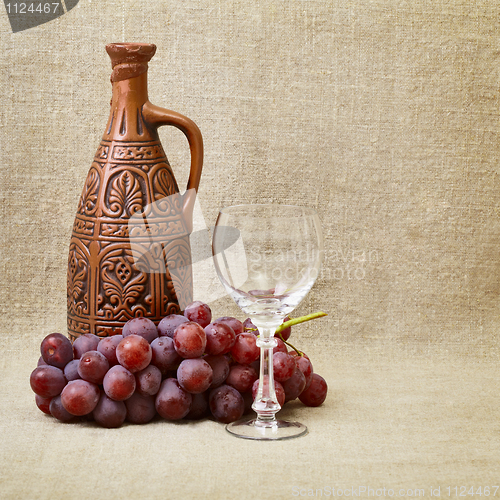 Image of Still-life - clay bottle, grapes and a glass on canvas