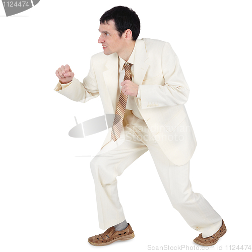 Image of Aggressive businessman, willing to attack on white
