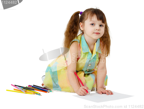 Image of Child draws with colored pencils