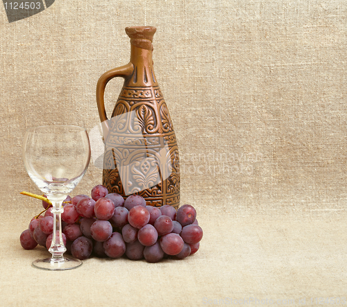 Image of Bottle, grapes and a glass on canvas