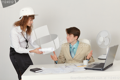 Image of Young engineers are working in office