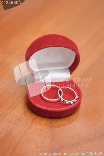 Image of Red casket with two wedding rings