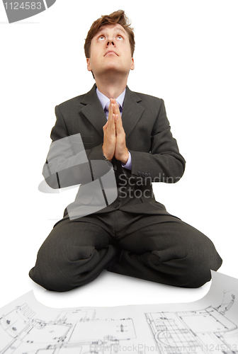 Image of Engineer prays to God