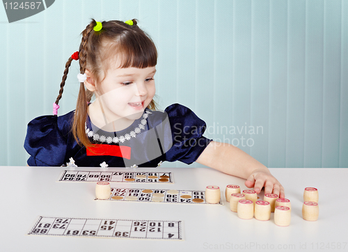 Image of Little girl playing with lotto