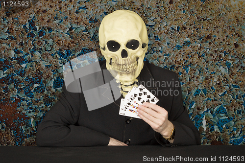 Image of Horrible cardsharper in mask - skull