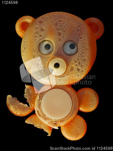 Image of Old chewed toy - bear on black background