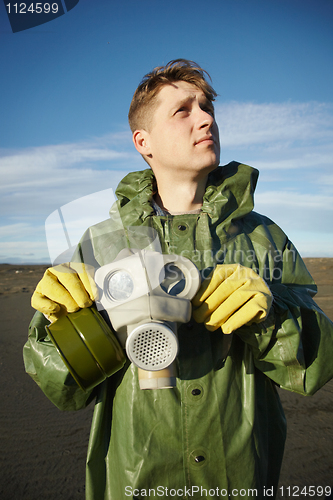 Image of Young scientist breathe air without gas mask