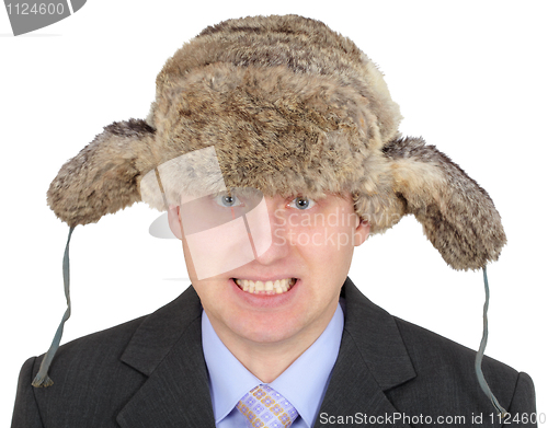 Image of Angry Russian businessman in fur hat on white