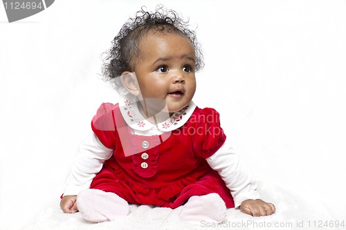 Image of Baby girl learning to sit