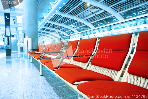 Image of long red chair in building