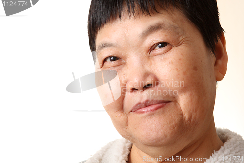 Image of Studio Portrait Of Smiling Senior Woman 