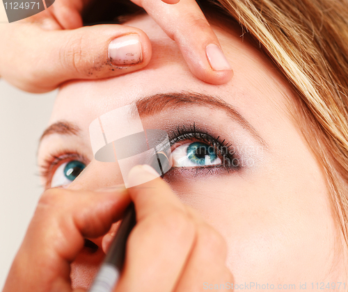 Image of Stylist is applying eyeshadow 