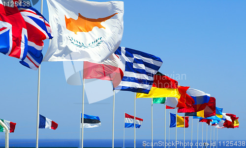 Image of Flags of the EU against blue sky