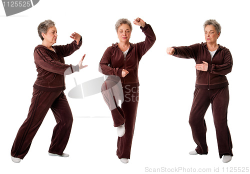 Image of Senior woman doing Tai Chi Yoga exercise